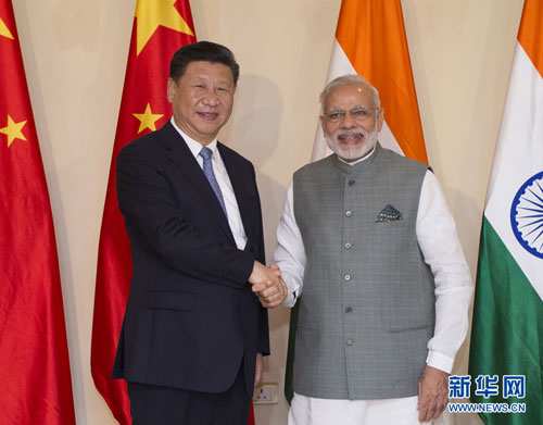 China’s Xi meets India’s Modi after signing border dispute agreement