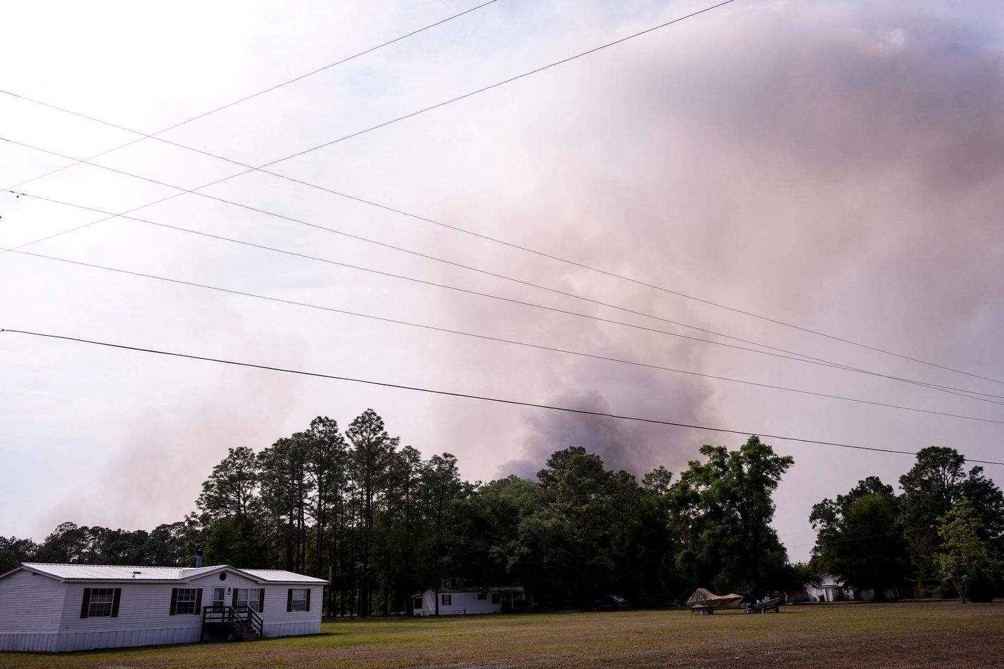 Wildfires across Georgia and Florida have destroyed nearly 50 homes and are forcing evacuations